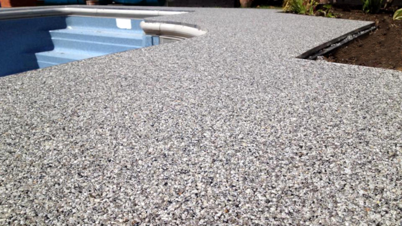 Resin Bound Stone swimming pool surround . Silver Quartz